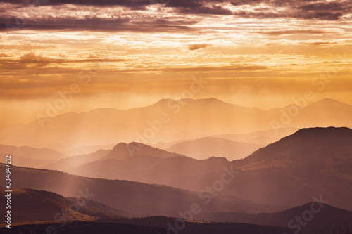 Rays of light over the mountains at sunset