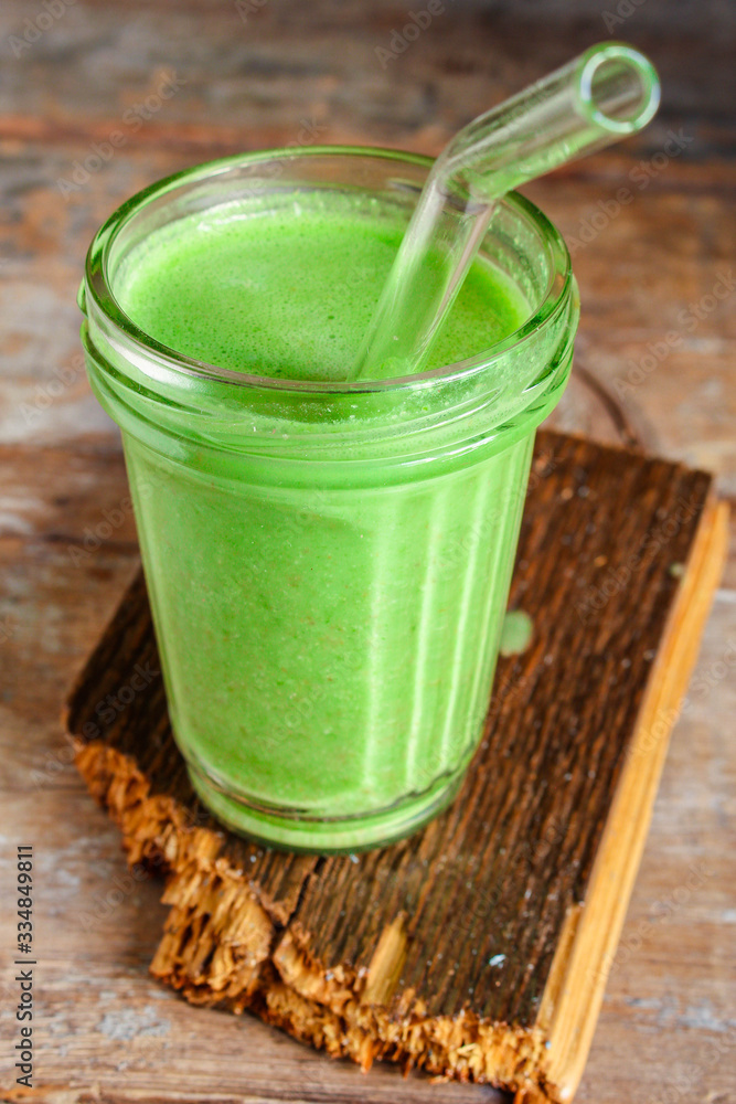green smoothie cocktail antioxidant diet (organic fruit vitamins, vegetarian drink) menu concept background. top view. copy space for text green smoothie cocktail antioxidant diet (organic fruit vitamins, vegetarian drink) menu concept background. top view. copy space for text