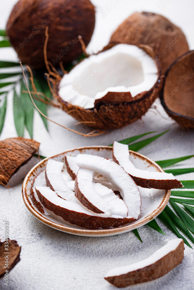 Sliced coconut and palm leaves Sliced coconut and palm leaves