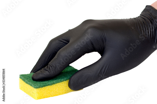 A hands in black cleaning gloves holding a yellow sponge, isolated on white background. 