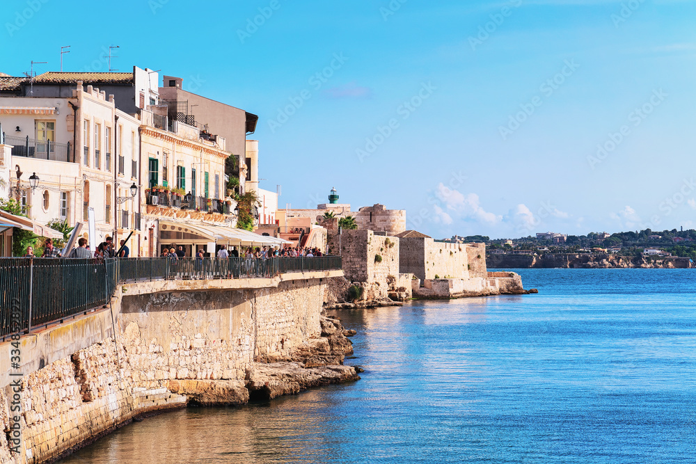 Embankment in old city in Siracusa and Mediterranean sea Sicily