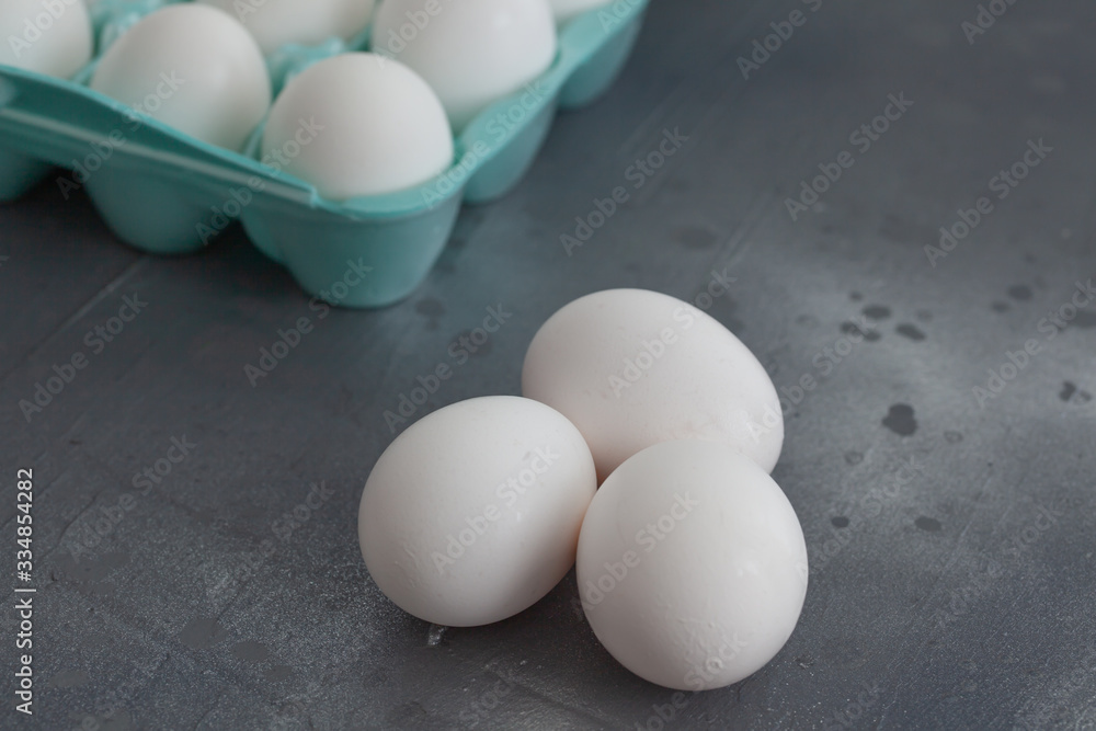 fresh eggs in green box on rustic metallic
table fresh eggs in green box on rustic metallic
table
