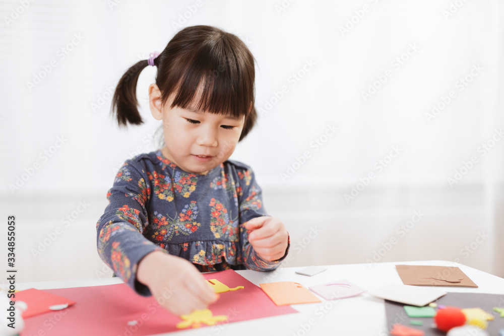 toddler girl making craft for homeschooling toddler girl making craft for homeschooling