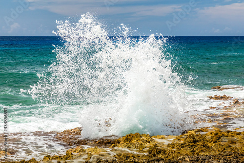 Spray from the famous Blow Holes on the south coast of Grand Cayman
