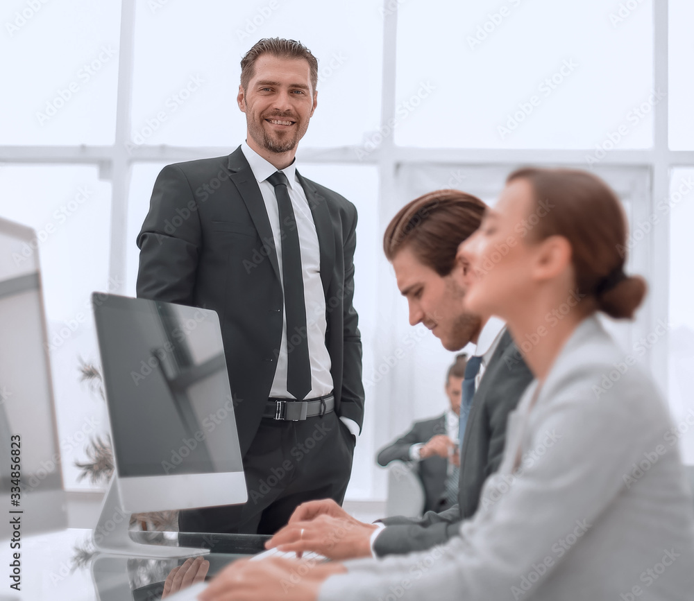 businessman standing in his office businessman standing in his office
