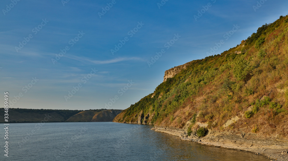 Fototapeta premium peaceful landscape nature scenic view hill land lake reservoir coast line calming outdoor environment spring time day HDR photography