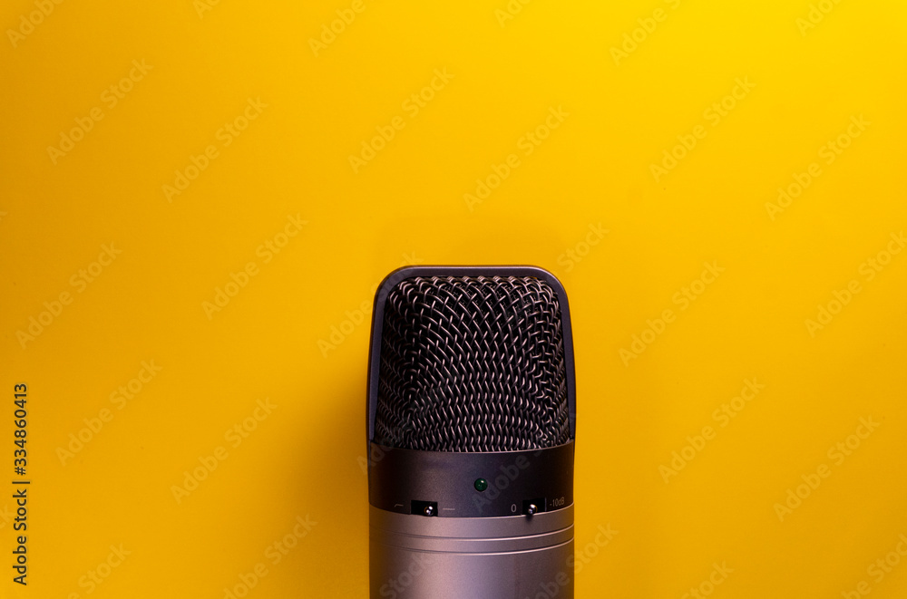 microphone on yellow background microphone on yellow background