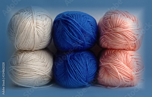 Colorful tangles of yarn in a blue frame