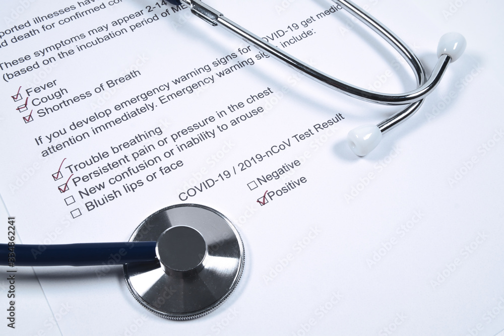 Positive test result for COVID-19 or novel coronavirus pandemic. Stethoscope and novel coronavirus test result on doctor's table Positive test result for COVID-19 or novel coronavirus pandemic. Stethoscope and novel coronavirus test result on doctor's table