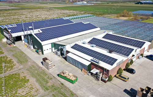 Roof of a building full of solar panels. The new green energy supplier for the future and now.