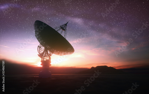 Fototapeta Naklejka Na Ścianę i Meble -  Huge satellite antenna dish for communication and signal reception out of the planet Earth. Observatory searching for radio signal in space at sunset.