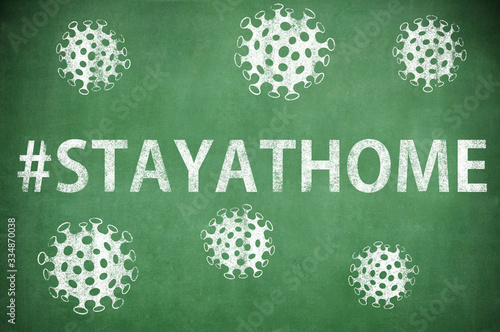 Information abaut coronaviruson  chalkboard, #STAYATHOME . photo