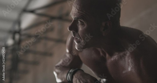 Man recovering in between workout