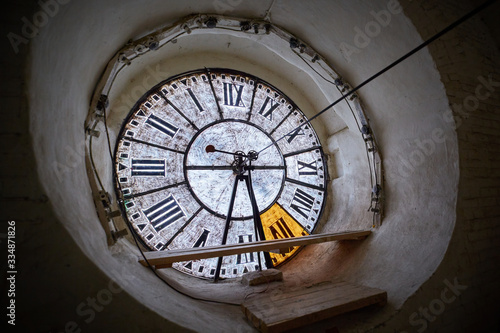View of the large clock-face of an antique clock on the tower