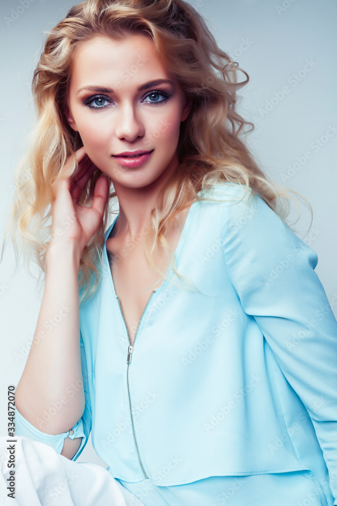 young pretty stylish blond hipster girl posing emotional isolated on white background happy smiling cool smile, lifestyle people concept young pretty stylish blond hipster girl posing emotional isolated on white background happy smiling cool smile, lifestyle people concept