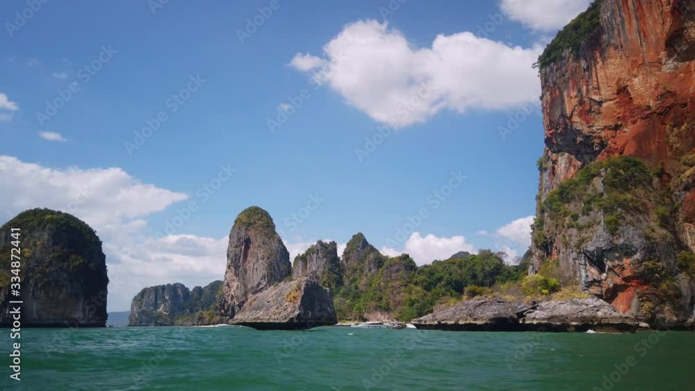Rough cliff mountain above blue sea Rough cliff mountain above blue sea