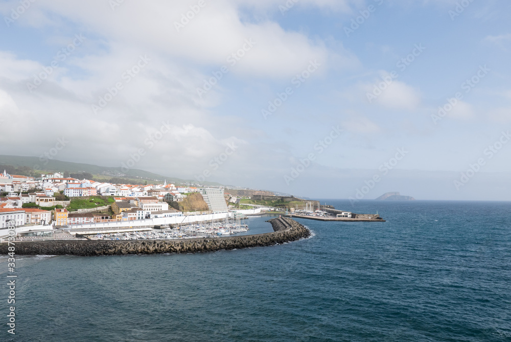 Scenic view of Terceira Island with water and marina at dusk