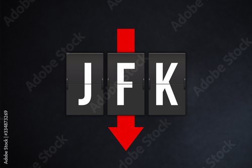 New York International Airport IATA code (JFK). Split-flap airport terminal alphabet and down red arrow on black background. Air traffic and aviation industry fall concept.