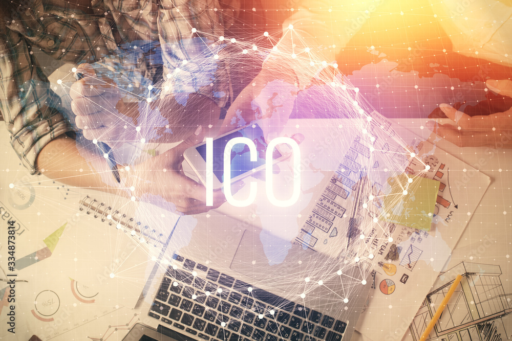 Double exposure of crypto theme drawing and man and woman working together holding and using a mobile device. Blockchain concept. Double exposure of crypto theme drawing and man and woman working together holding and using a mobile device. Blockchain concept.