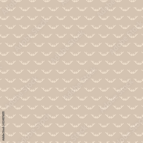 Deer antler seamless pattern. Ditzy natural brown flat color background.  Childish hand drawn animal doodle style. For woodland textile, rustic nature all over print.  Simple drawn swatch.