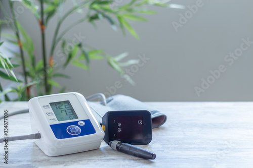 Digital blood pressure monitor for blood pressure monitoring and glucometer to control blood glucose levels photo