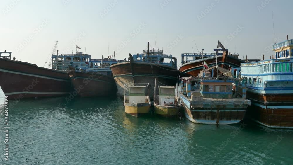 Left to right pan of Iranian launch Lenj fishing boats in a harbour in the strait of Hormuz Left to right pan of Iranian launch Lenj fishing boats in a harbour in the strait of Hormuz