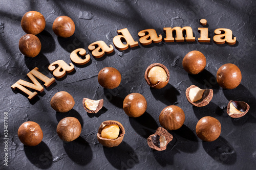 Phrase macadamia in wood letters - Macadamia integrifolia