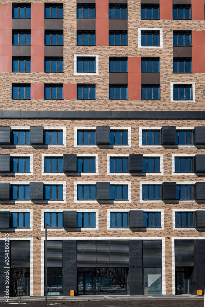 Fragment of the facade of a newly built residential building in Moscow, front view, high resolution