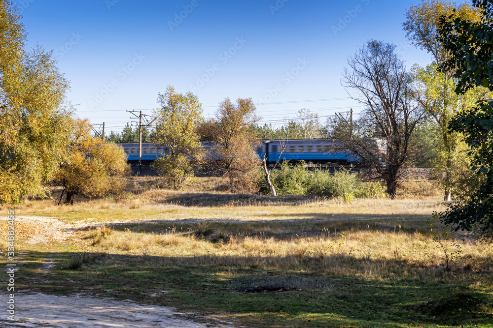 a high speed electric passenger train passes through the countryside a high speed electric passenger train passes through the countryside