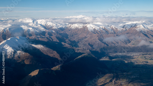 Mountains with snow caps  Aerial shot of Southern Alp made in Queenstown  New Zealand