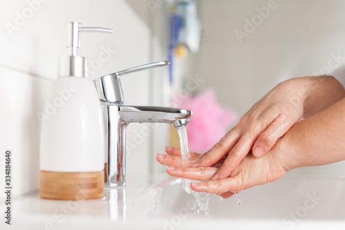 Hygiene concept. Woman washing hands close up. Hand hygiene for coronavirus outbreak. 