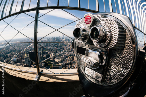 Obraz na płótnie Detail of binoculars and background view of New York City from the Empire State Building
