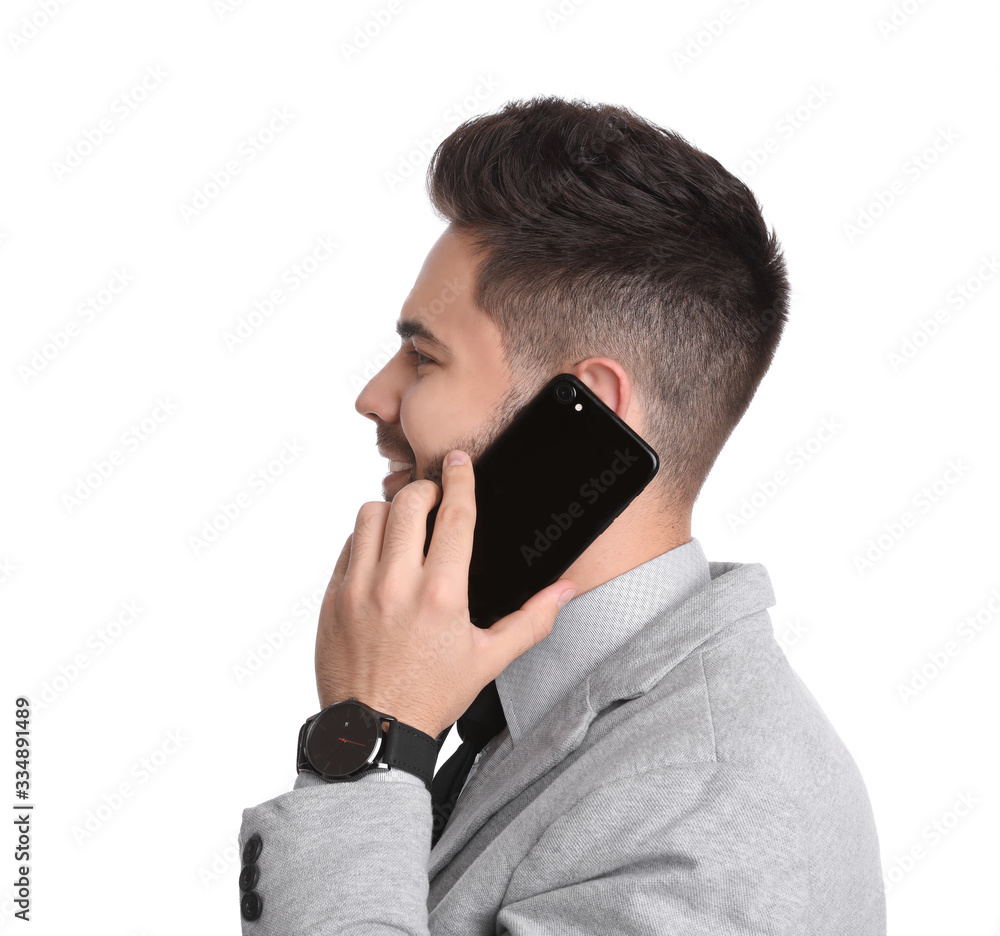 Young businessman talking on smartphone against white background Young businessman talking on smartphone against white background