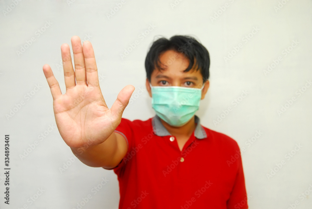 Stop the infection! Healthy man showing gesture Stop the infection! Healthy man showing gesture