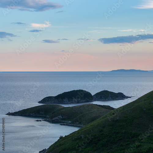 sea hilly coast at sunset