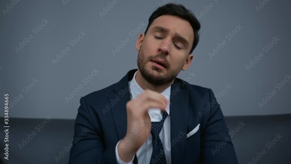 tired businessman touching tie in hotel tired businessman touching tie in hotel