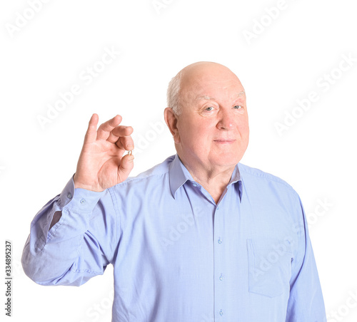 Senior man with fish oil on...