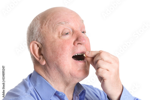 Senior man with fish oil on...