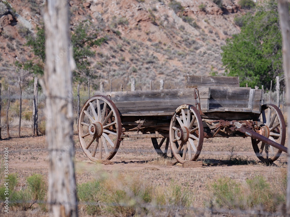 Old harvesting machine with rusty wheels displayed along the road at the Grafton ghost town, a town washed away by the Great Flood of 1862, Utah.