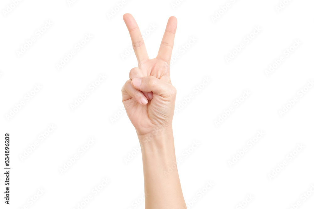Woman's hand showing the sign of victory and peace close-up isolated on white background. Woman's hand showing the sign of victory and peace close-up isolated on white background.