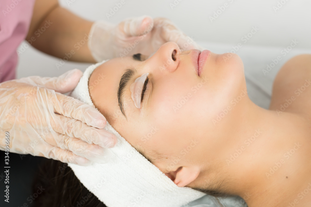 young lady receiving an eyelash treatment