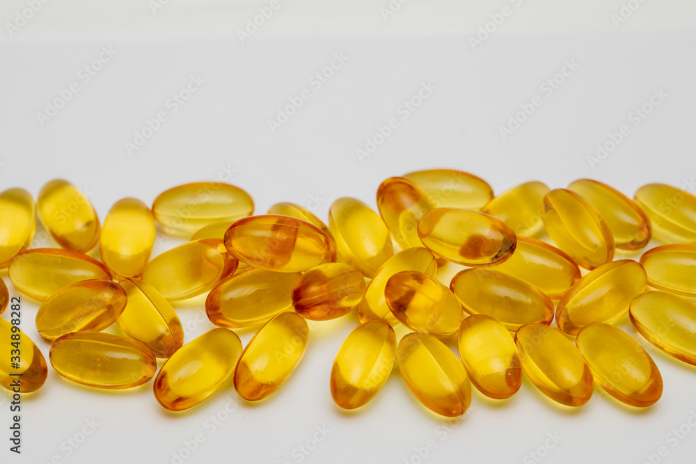 Close up of food supplement oil filled capsules suitable for: omega 3, omega 6, vitamin A, vitamin D, vitamin E Close up of food supplement oil filled capsules suitable for: omega 3, omega 6, vitamin A, vitamin D, vitamin E