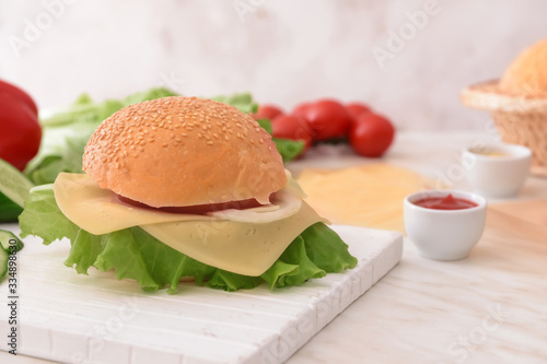 Ingredients for tasty burger on table