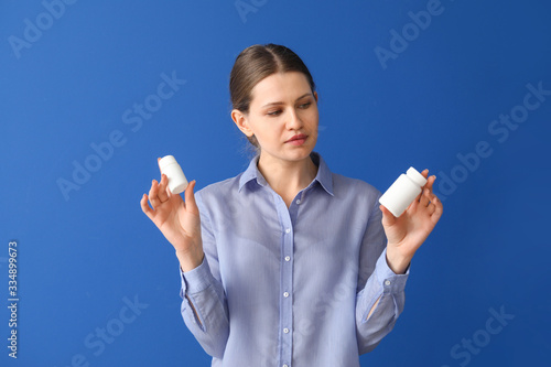Young woman with medicines ...