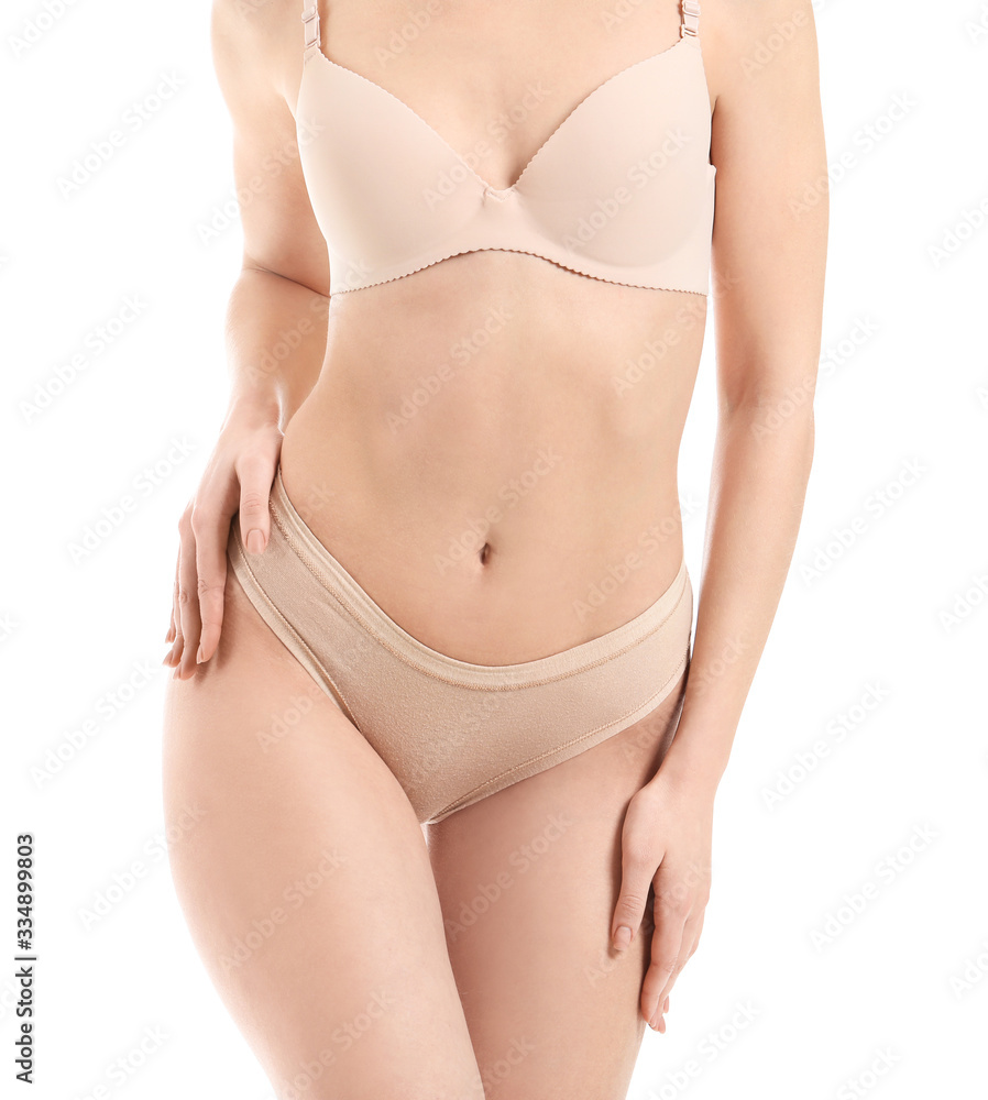 Young woman in underwear on white background. Plastic surgery concept