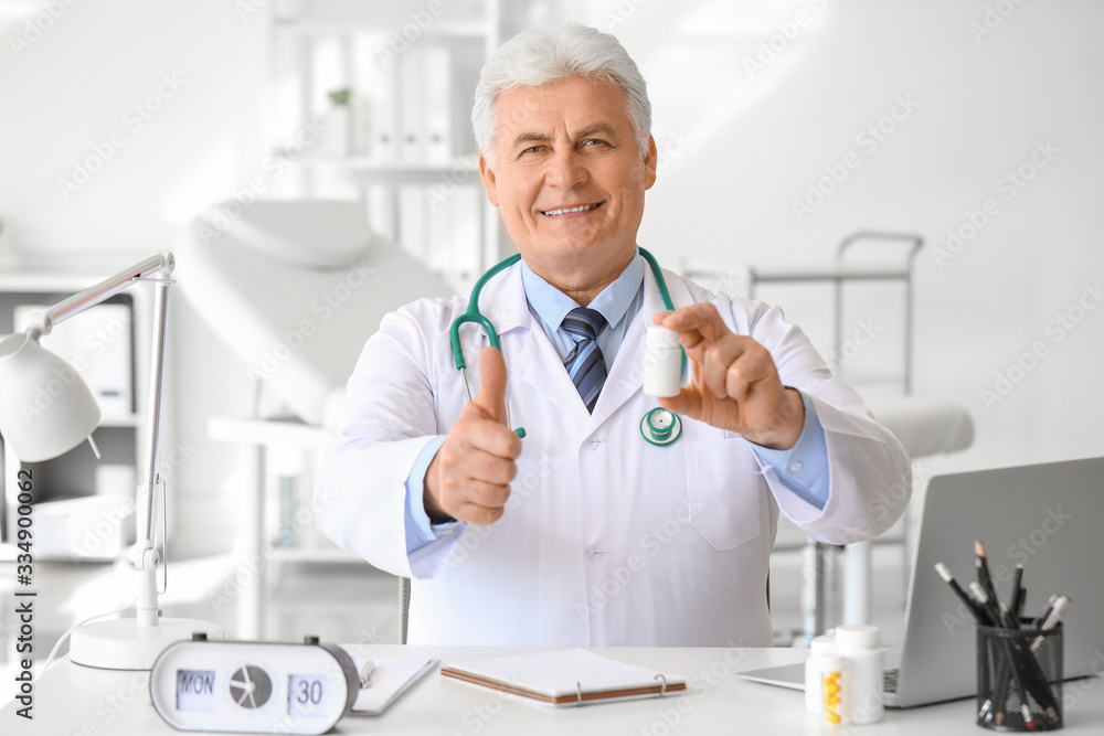 Senior doctor with pills in clinic