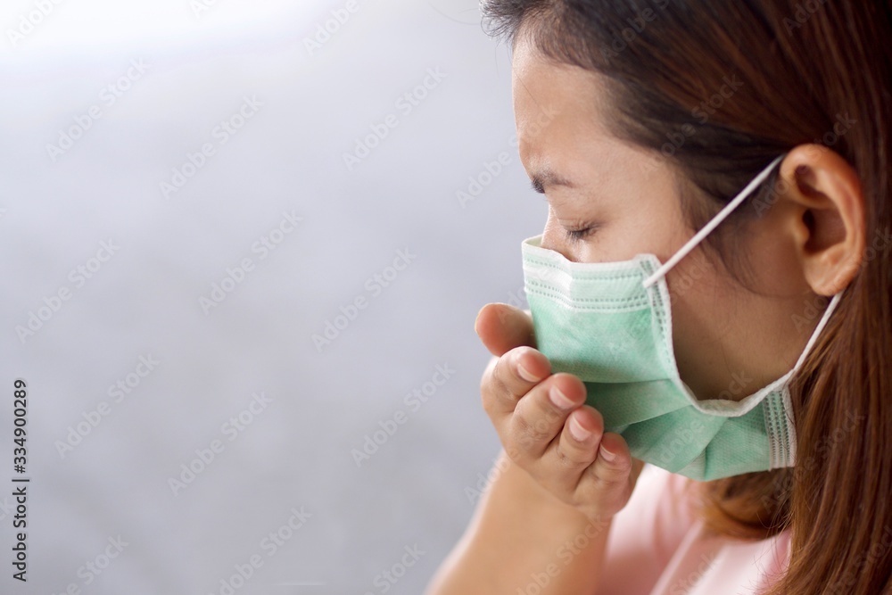 Health concepts, women wearing masks She is sick and has a fever. Due to getting a virus or caused by a weak body. Health concepts, women wearing masks She is sick and has a fever. Due to getting a virus or caused by a weak body.