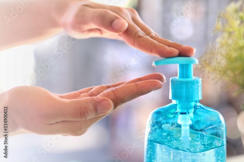 Health concept  young woman s hand is cleaning hands with alcohol gel To get rid of various germs and viruses.