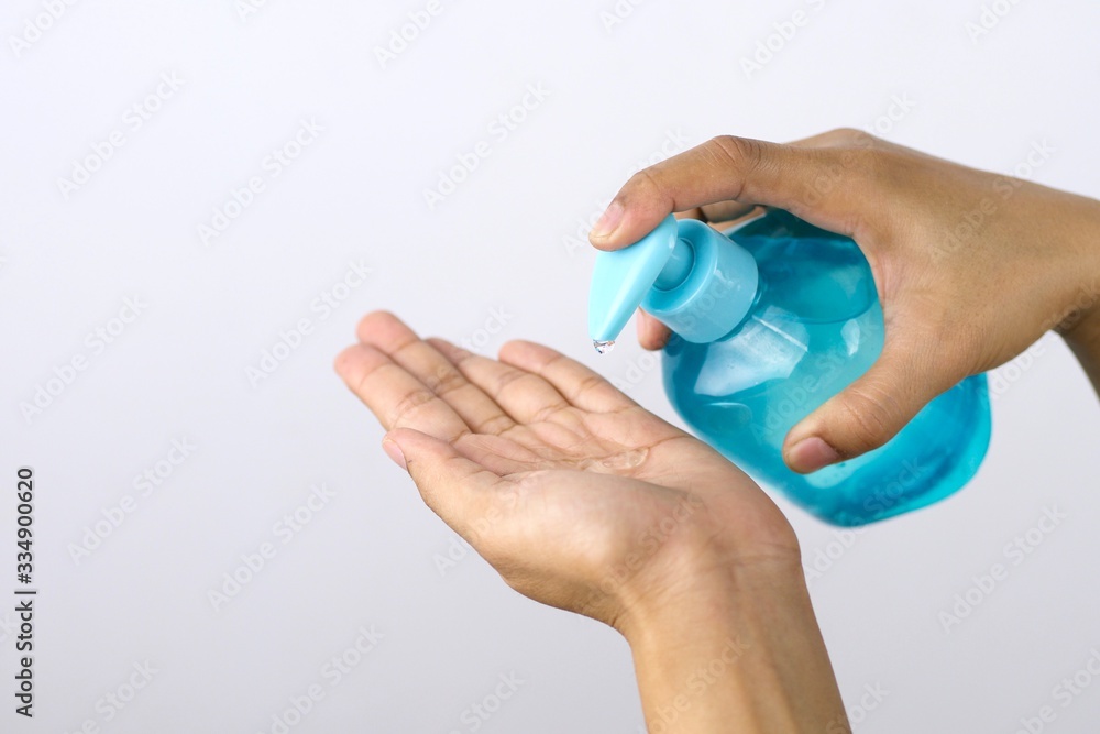 Health concept, young woman's hand is cleaning hands with alcohol gel To get rid of various germs and viruses. Health concept, young woman's hand is cleaning hands with alcohol gel To get rid of various germs and viruses.