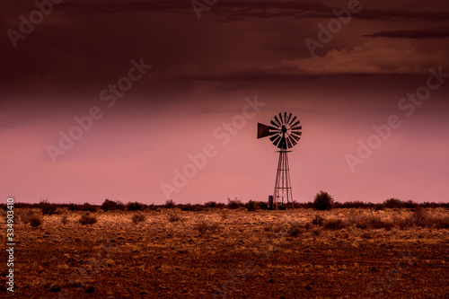 silhouette of windmill at sunset